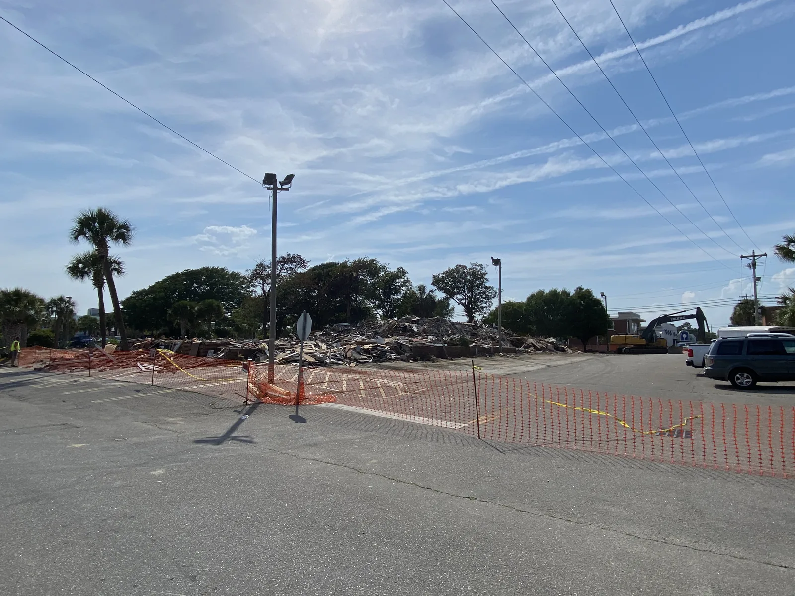 Commercial demolition site with debris removal underway