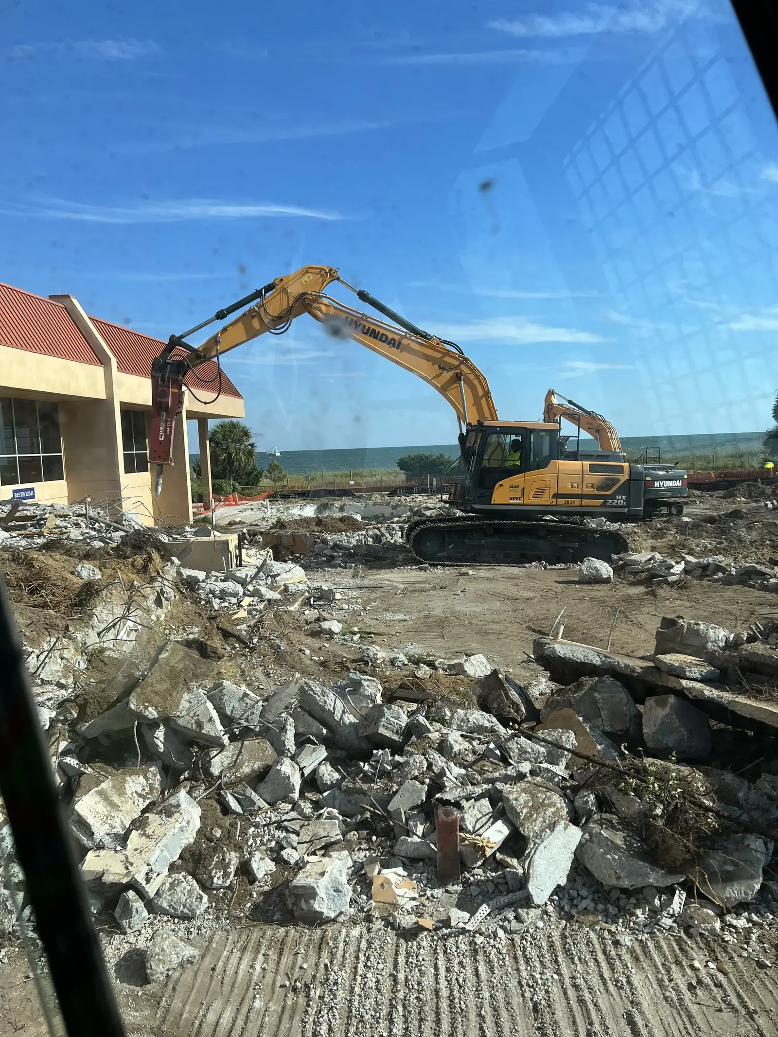 Excavators performing oceanfront commercial demolition in Myrtle Beach