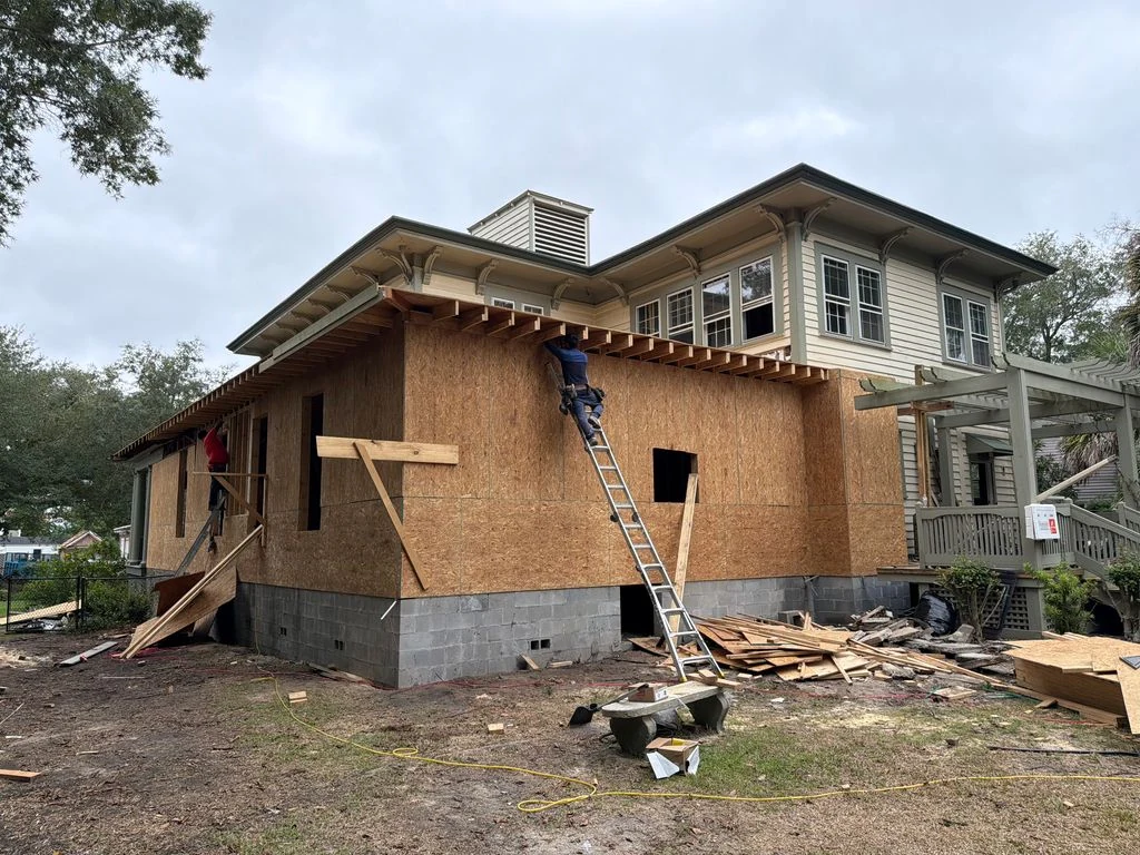 Exterior wall and roof framing under construction for a residential home addition