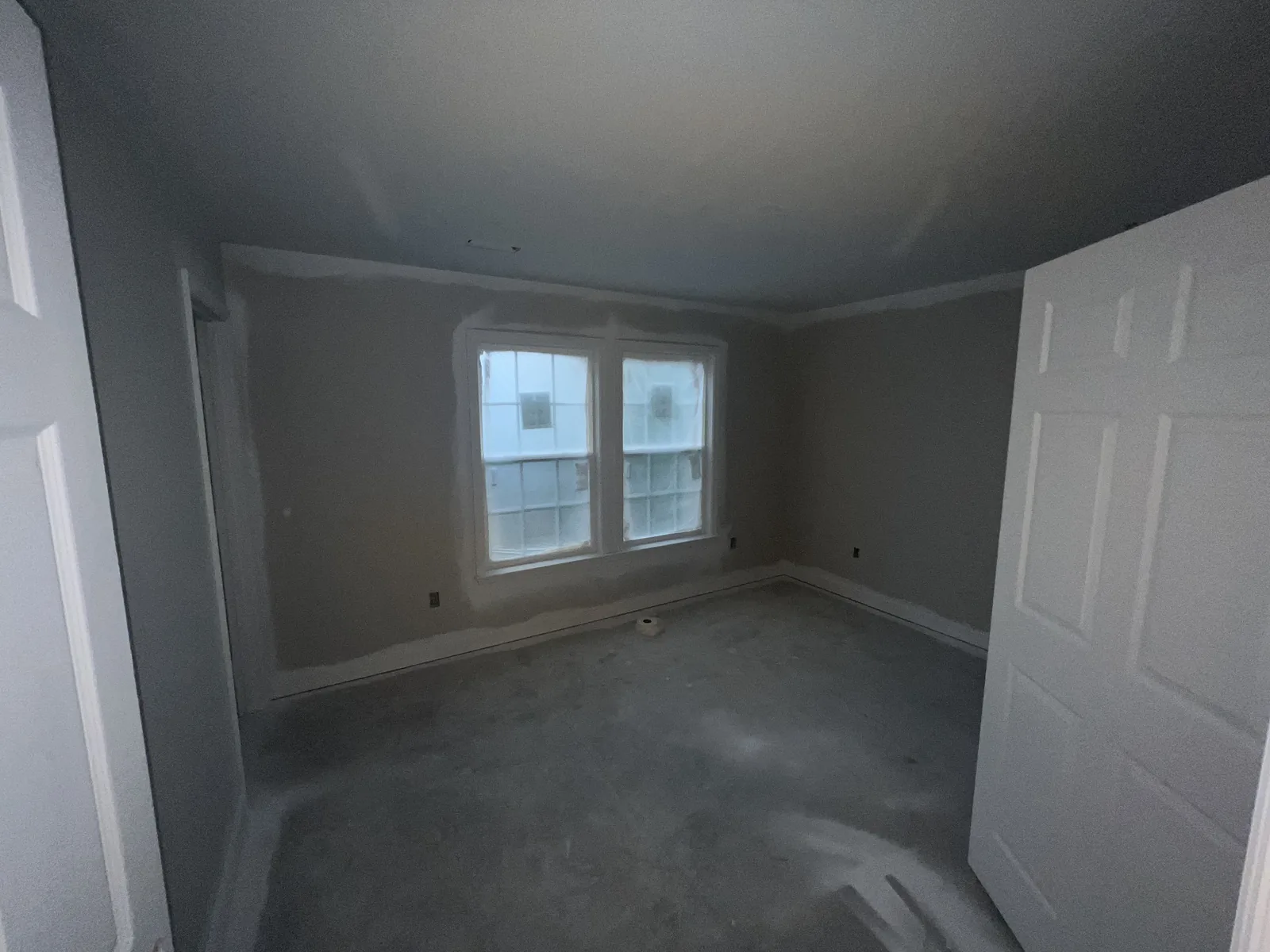 Bedroom finish work inside the completed JMEC home