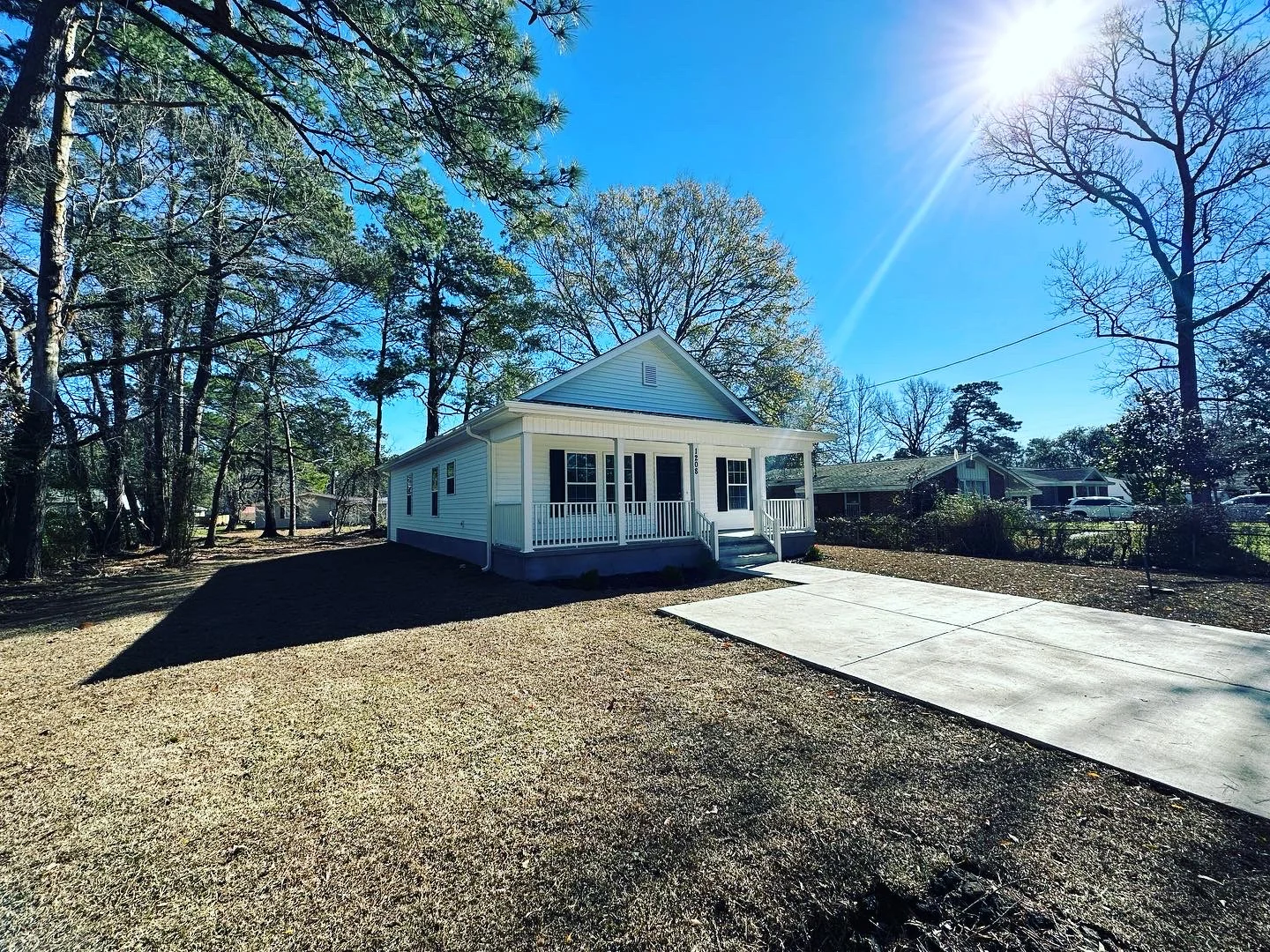 Angled exterior view of the same completed JMEC home