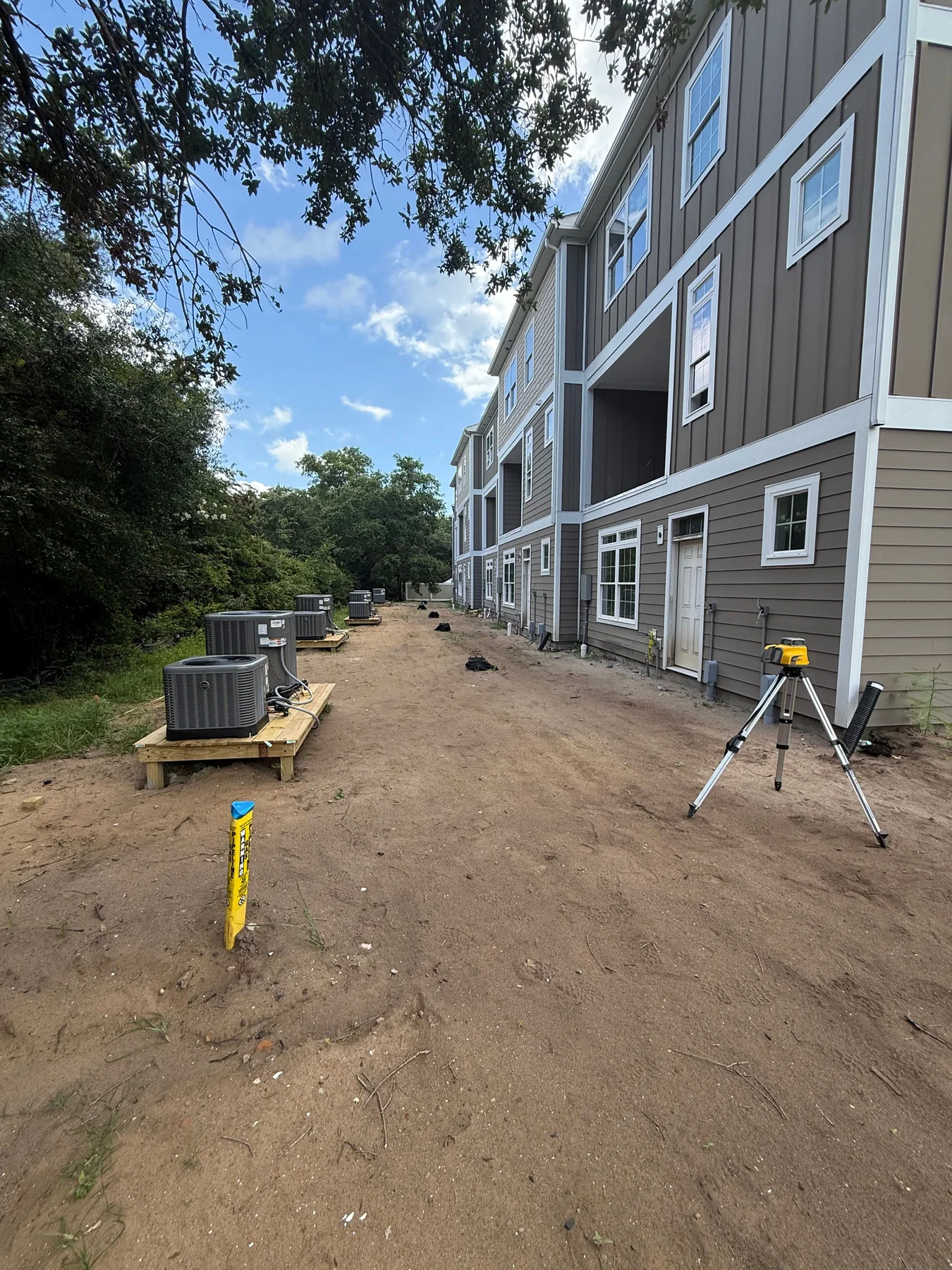 Multifamily residential buildings during exterior construction and site preparation